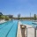 Lounging chairs and lap pool ft. wellness center